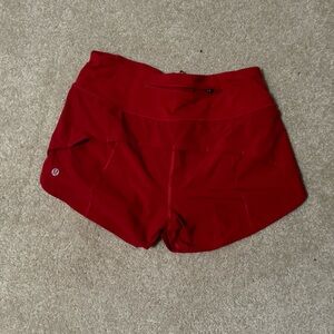 Red Lululemon athletic shorts